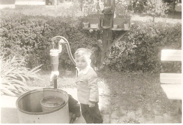 Jeffrey Wiles with hand water pump
