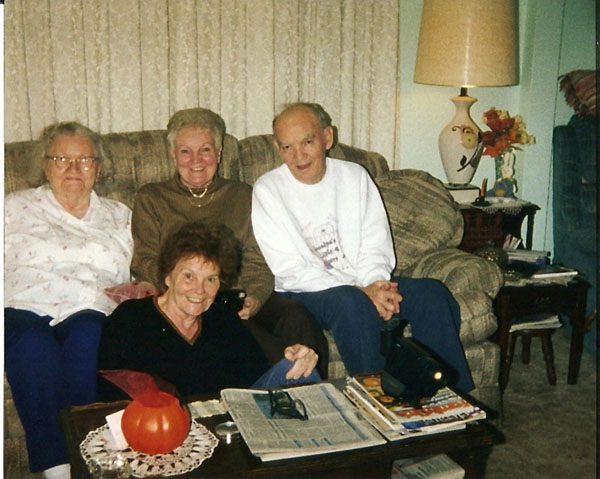 (on couch) Grace Brown, Marlene Demchek and Russell Wiles, (on floor) Ann Grundner